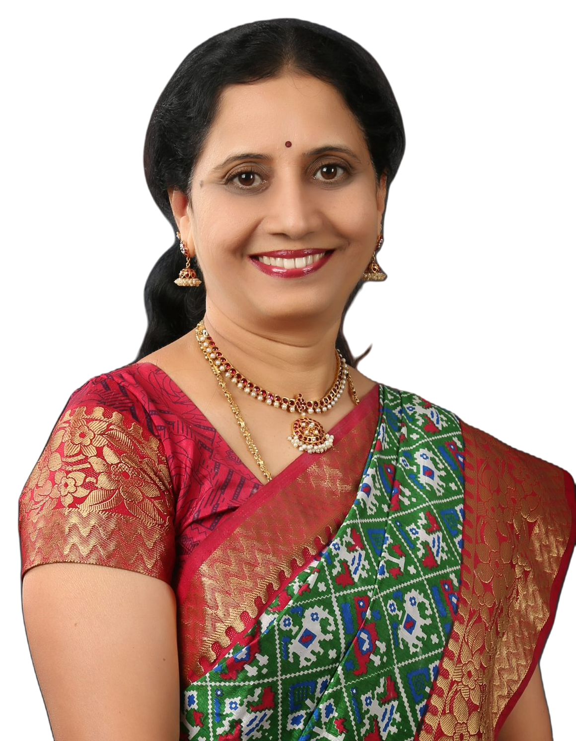 Studio portrait of Dr. P. Lakshmi Satish in a red and gold saree.