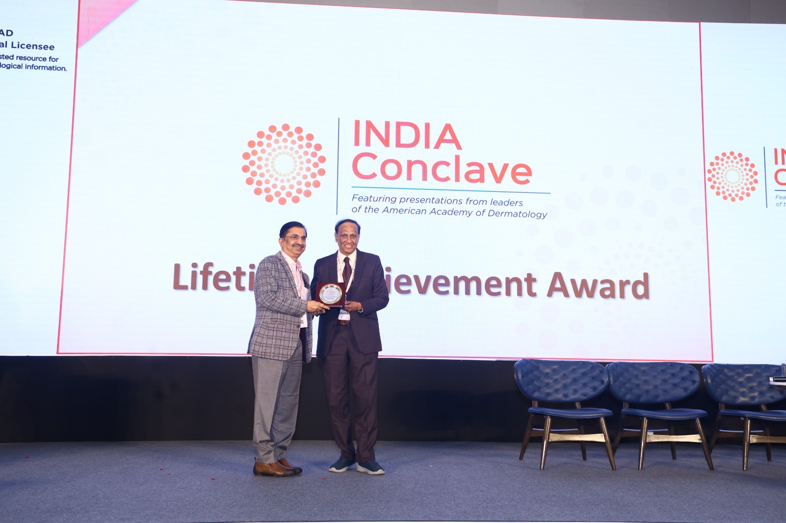 Dr. D. A. Satish on stage receiving a Lifetime Achievement Award plaque from a presenter, with the INDIA Conclave screen reading "Lifetime Achievement Award" behind them.